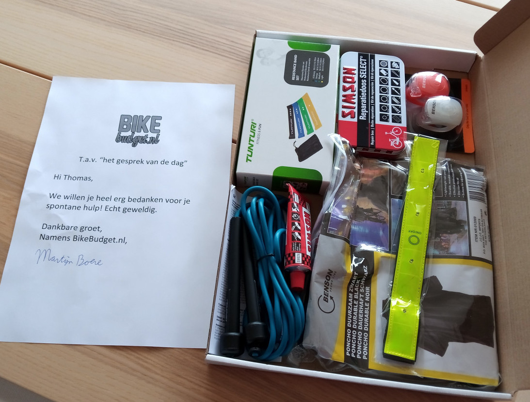 bikebudget swag box with thank you note, tire fix set, and a bunch of small items